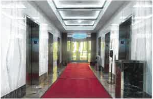 Hallway with windows bordering the pool